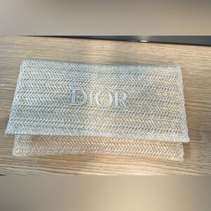Dior beauty raffia clutch with pearl  strap.
